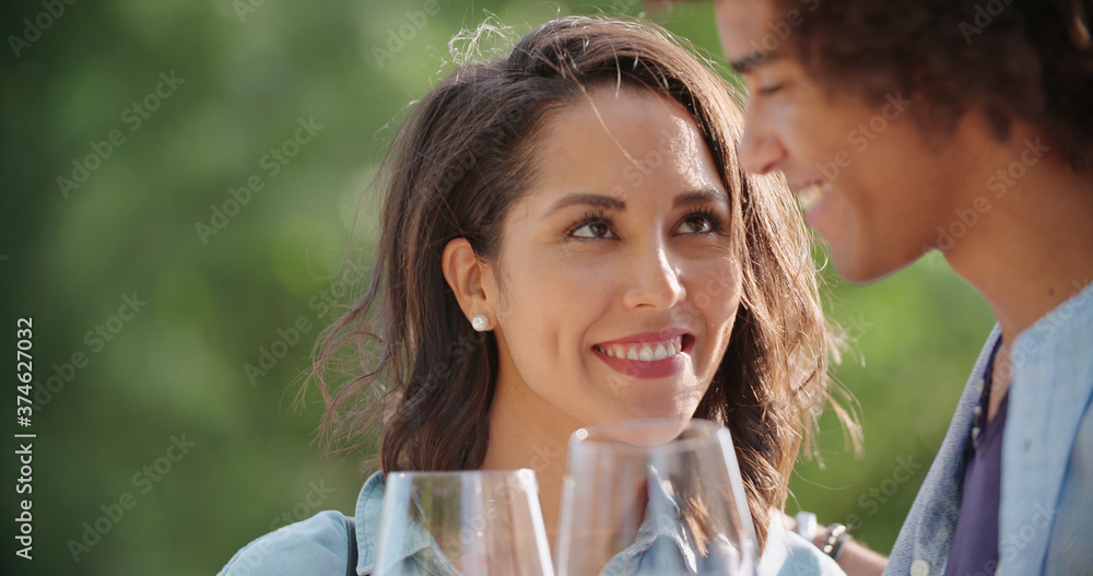 Obraz premium Romantic young woman and man tasting wine having degustation at vineyard winery.Wine tasting.Red wine tasting people enjoy drinking.Close up.Woman looking to man with wine glass smiling