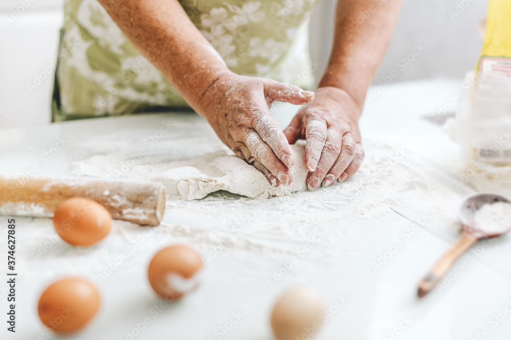 Woman kneading dough at home kitchen Woman kneading dough at home kitchen