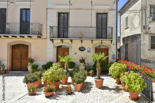 A narrow street among the old houses of Santa Croce del Sannio, a rural village in the Campania region.