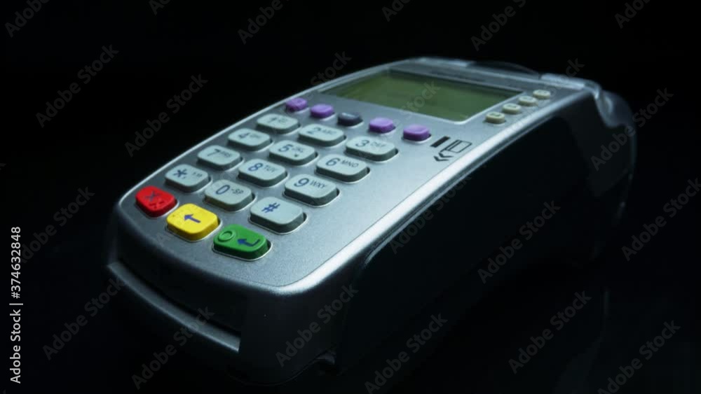 Customer paying with mobile phone over pos terminal with NFC technology Customer paying with mobile phone over pos terminal with NFC technology