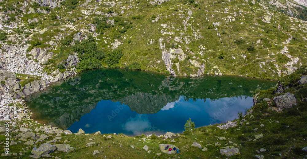 Aerial view of the alpine Denza lake (Presanella lake) in the Adamello - Presanella group, Vermiglio in Trentino Alto Adige, northern Italy, Europe. Italian alps Aerial view of the alpine Denza lake (Presanella lake) in the Adamello - Presanella group, Vermiglio in Trentino Alto Adige, northern Italy, Europe. Italian alps
