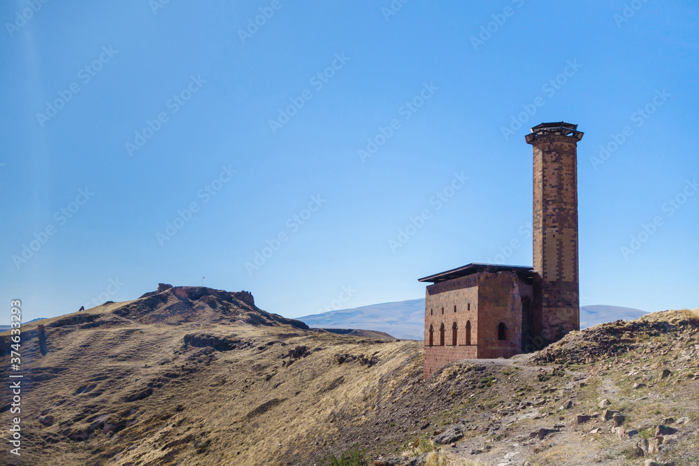 Panoramic view onto Seljuk mosque of Manuchihr on edge of canyon, that surrounding medieval city Ani, near Kars, Turkey. Main citadel is on background. All these buildings are on UNESCO Heritage List
