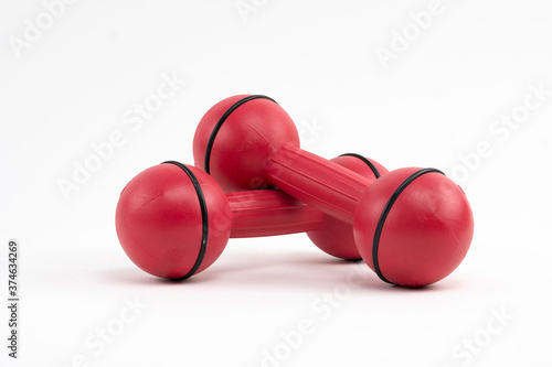 Red dumbbells on a white background