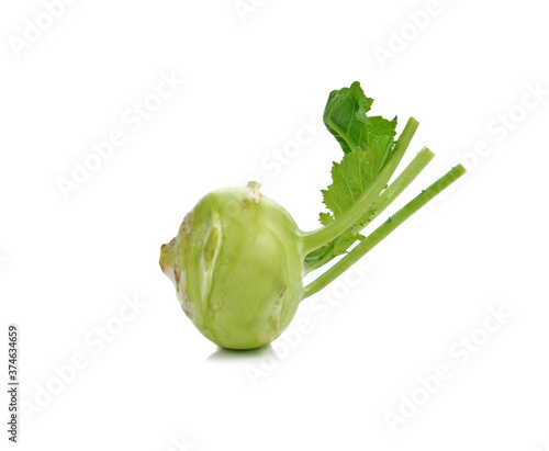 Fresh kohlrabi with green leaves on isolated white backround. photo