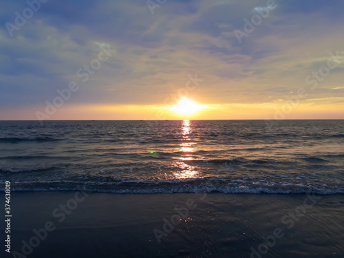 sunset on the beach, wave on the beach, beautiful sunset view in the Indian Ocean, sunset view in the goa, ©  Rima
