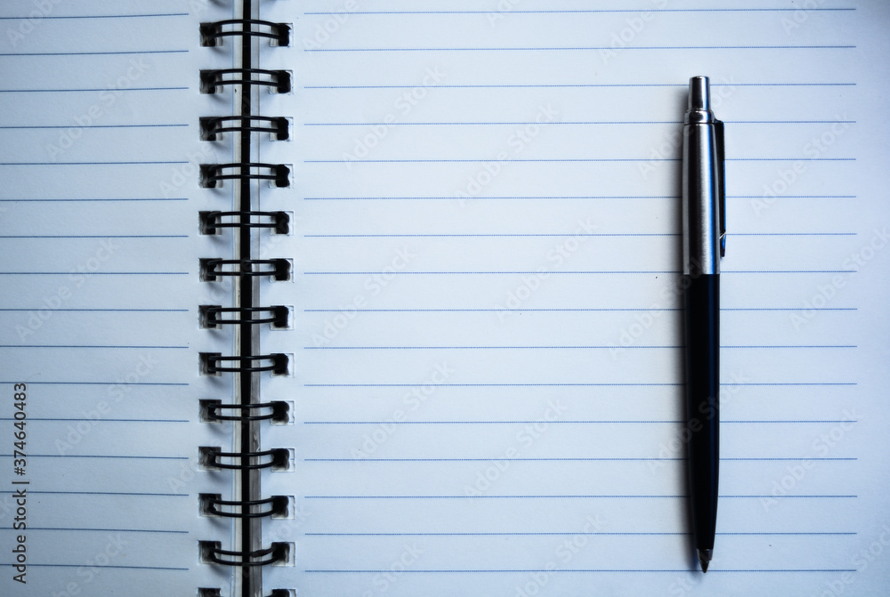 Ruled notebook blank page with pen Ruled notebook blank page with pen