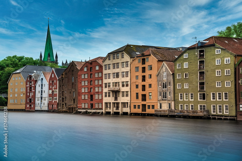 The colorful and iconic old city wharves along the Nidelva river in Trondheim, Trondelag, Norway. Symbol of the historical role of Trondheim as a merchant city.
