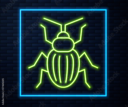 Glowing neon line Chafer beetle icon isolated on brick wall background. Vector.