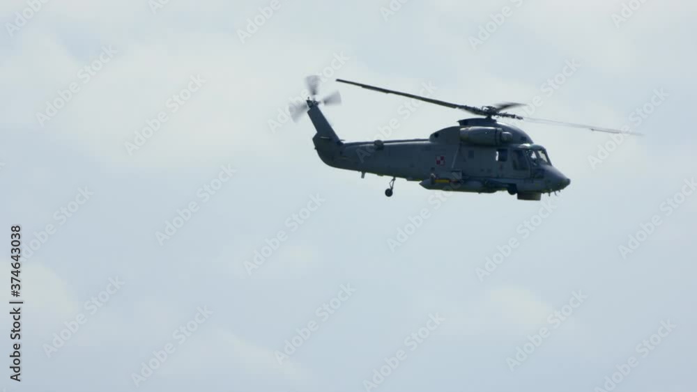 Mi-14PŁ helicopter doing maneuvers at air show in Gdynia Mi-14PŁ helicopter doing maneuvers at air show in Gdynia