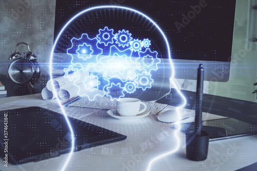 Multi exposure of work space with computer and human brain hologram. Brainstorm concept.
