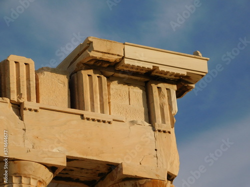 View of an upper corner of the Parthenon, the ancient temple of goddess Athena, in Athens, Greece photo