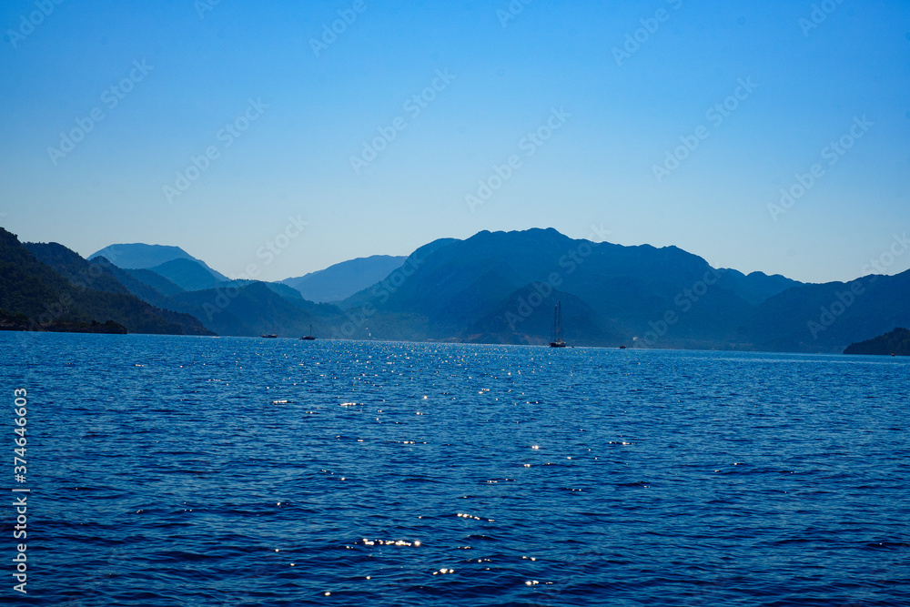 mountain lake and blue sky with clouds