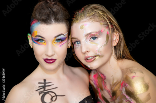 Two pretty young women with creative make-up