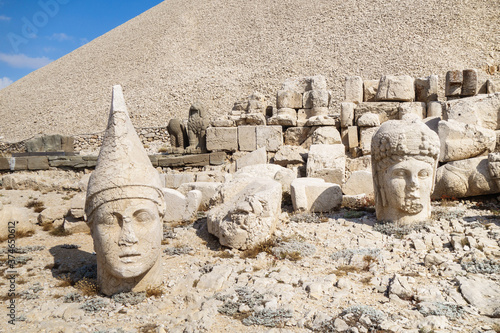 Stone heads of god Apollo-Mihr   goddess Tyche-Bakht on mount Nemrut  Kahta  Turkey. Heads fell from their bodies during earthquake. Built as part of burial complex in 65 BC  now it s UNESCO object