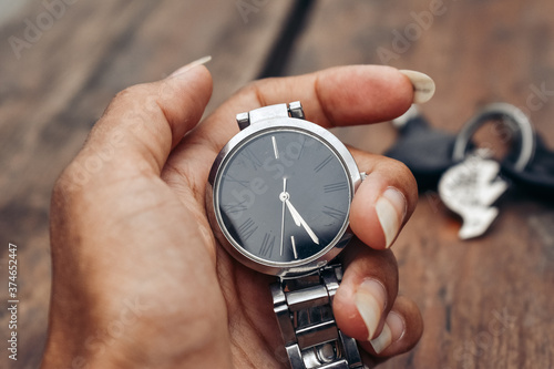 hand holding a watch