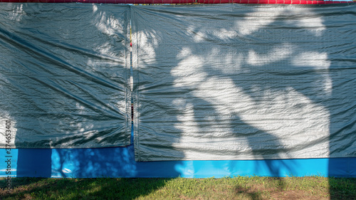 tarpaulin canvas material covered large building wall on construction site