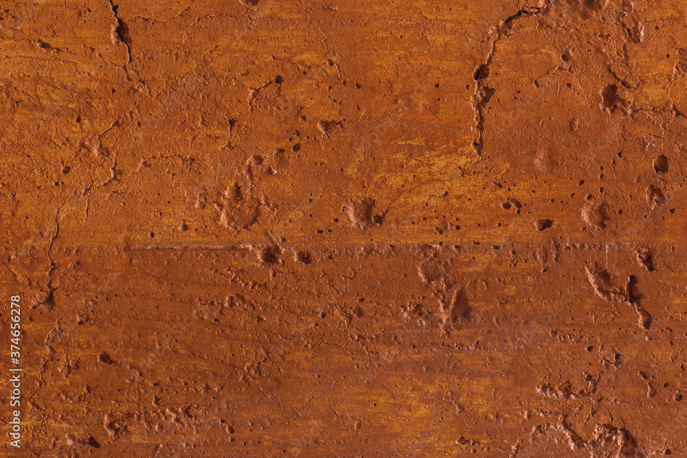 Fototapeta premium Traditional moroccan terracotta colored background. Orange or ocher clay wall texture. Painted shabby concrete.