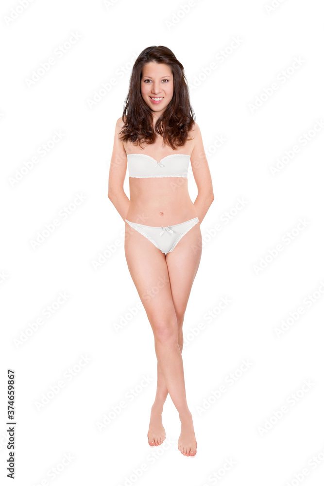 Full length portrait of an attractive cheerful woman wearing bra and panties, studio photo isolated in front of white background Full length portrait of an attractive cheerful woman wearing bra and panties, studio photo isolated in front of white background