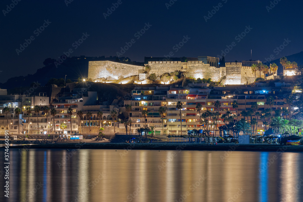 Views of Almuñecar with its Arabian castle and its rocks at nightfall. Long exposure.
