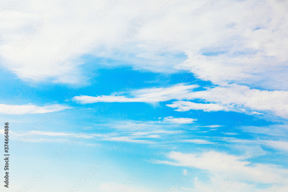 Abstract texture of white clouds on blue sky out of focus for use as background