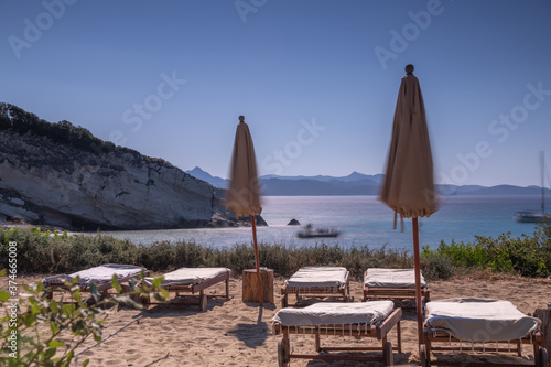 Beach chairs and umbrella by the sea © LaSu