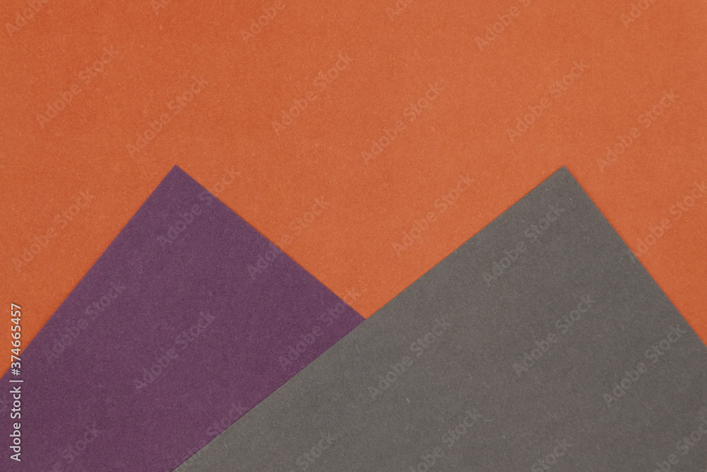 Fototapeta premium Grey, Purple and Orange coloured paper background