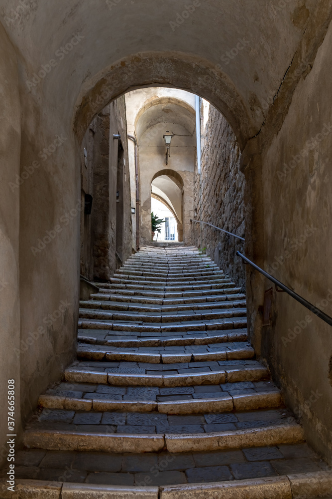 Naklejka premium old stone staircase at Marta, Lake Bolsena, Italy