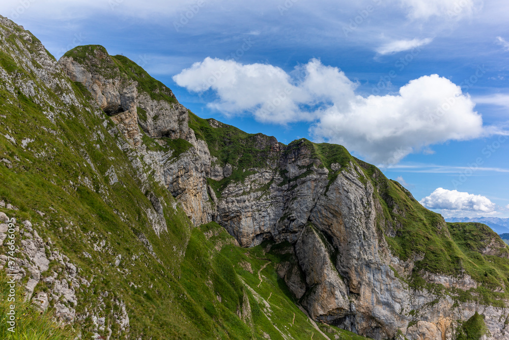 The  steep path leading to the majestic  Schaefler peak in the  Alpstein mountain range around the Aescher cliff in Appenzell, Switzerland