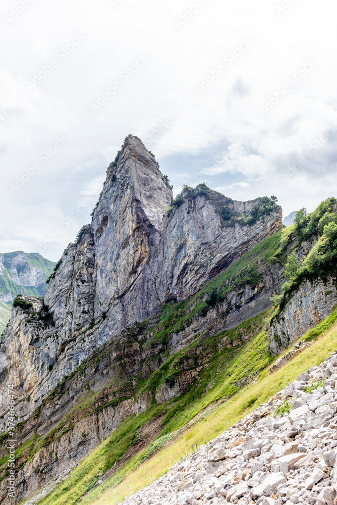 The steep ridge of the majestic Schaefler peak in the Alpstein mountain range in Appenzell, Switzerland