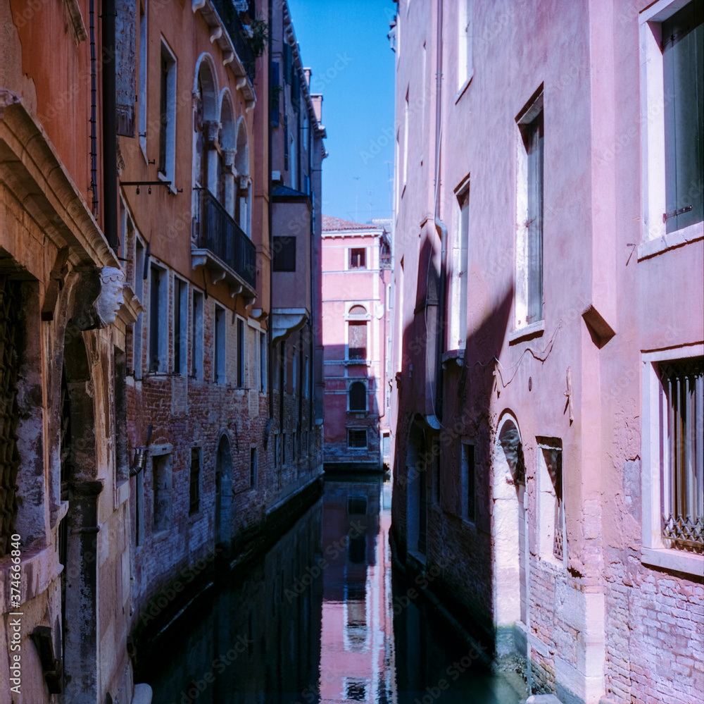 View of the  water channels, bridges and old palaces in Venice shot with analogue colour film technique