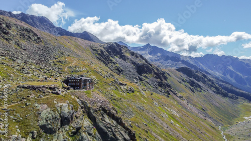 Cevedale Larcher refuge in the Pejo Valley ( 2.715 m s.l.m) in the heart of Stelvio National Park, Trentino Alto Adige, northern Italy. Panoramic view from above. Italian alps
