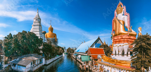 Around the khlong near Wat Paknam Bhasicharoen, a temple, pagoda and Buddha statue in Bangkok Thailand