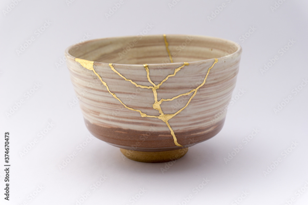 Kintsugi beige tea ceremony chawan bowl. Gold cracks restoration on old ...