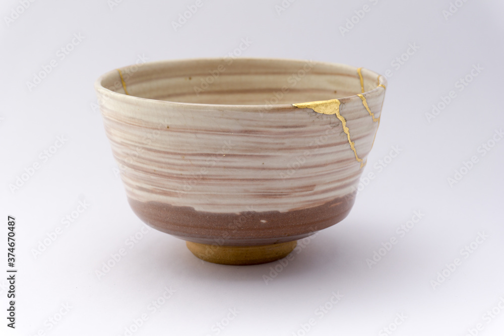 Kintsugi beige tea ceremony chawan bowl. Gold cracks restoration on old ...