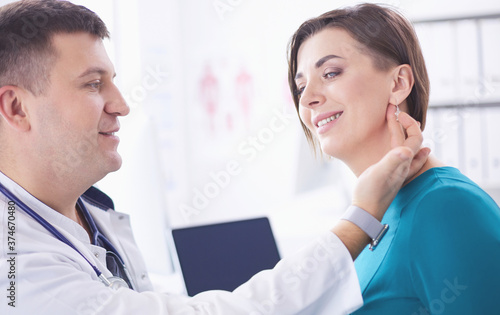 The patient and his doctor in medical office photo