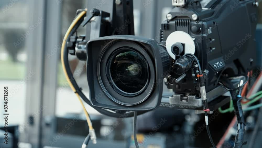 Film crew in outdoor studio shooting video. Camera on crane jib. Filmmaking industry. Film crew in outdoor studio shooting video. Camera on crane jib. Filmmaking industry.