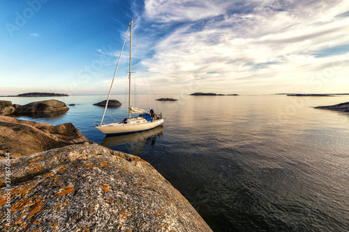 Sailboat and remote islets in Stockholm archipelago