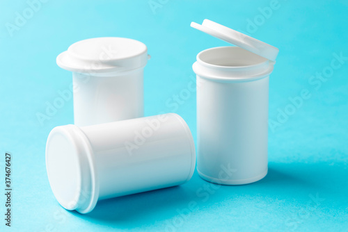 Medical containers on a blue background