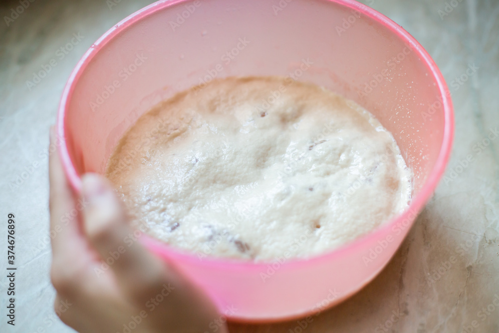Preparing yeast for yeast dough in bowl. Activate the dry yeast for bread making, pie.