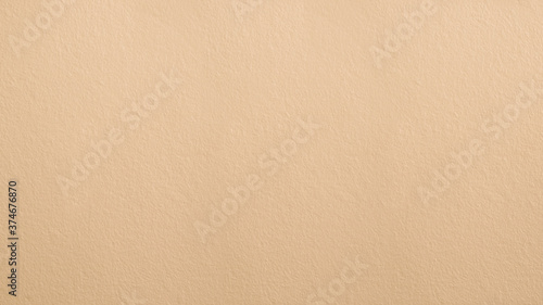 Close up of vintage yellow color concrete wall texture for background. © Daronk
