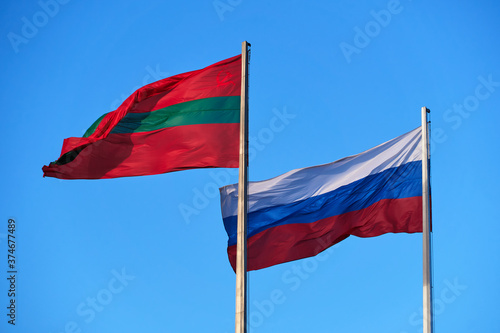 the national flag of Transnistria and Russia against the sky
