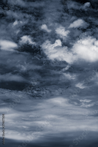 Dramatic dark gray sky after storm. Vertical photo.