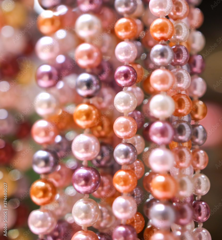 Pearl beads on a pink counter