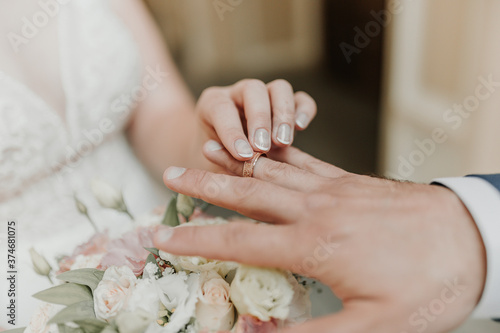 The bride and groom exchange wedding rings.