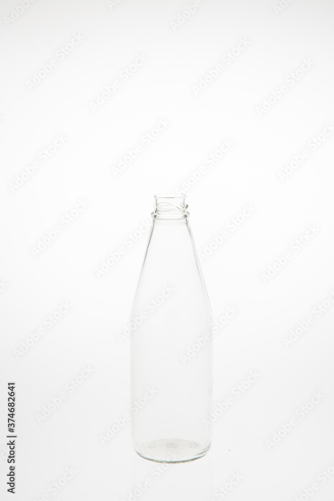 Isolated glass bottle on white background without cap. Isolated glass bottle on white background without cap.