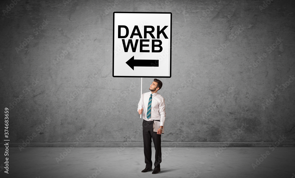 business person holding a traffic sign with DARK WEB inscription, new idea concept business person holding a traffic sign with DARK WEB inscription, new idea concept