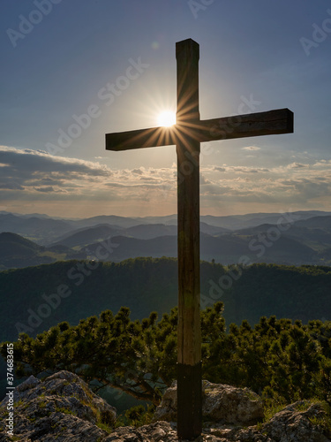 summit cross at sunset mount Peilstein Austria