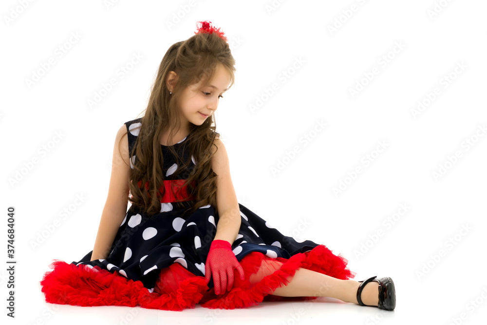 Pretty Girl Wearing Polka Dot Dress Sitting on the Floor Pretty Girl Wearing Polka Dot Dress Sitting on the Floor