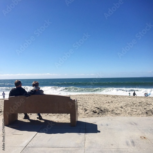 A couple on a bench in the artist colony of Laguna Beach.