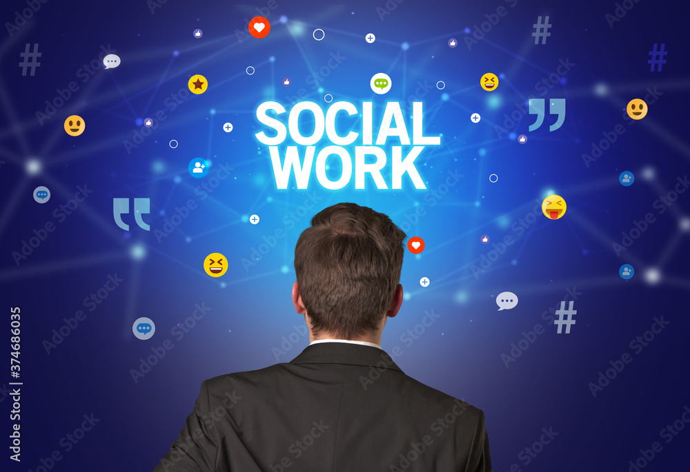 Rear view of a businessman with SOCIAL WORK inscription, social networking concept Rear view of a businessman with SOCIAL WORK inscription, social networking concept